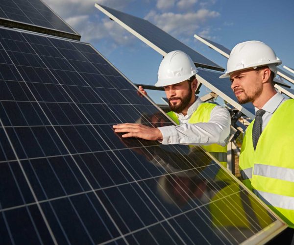 technicians-examining-solar-panels-installation-2022-11-23-00-45-19-utc
